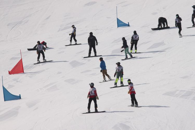 Snowboarders on hill