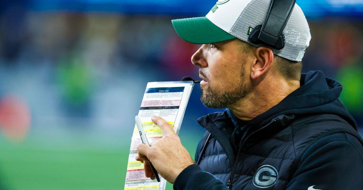 Green Bay Packers head coach Matt LaFleur stands on the sideline during the fourth quarter at Lumen Field.