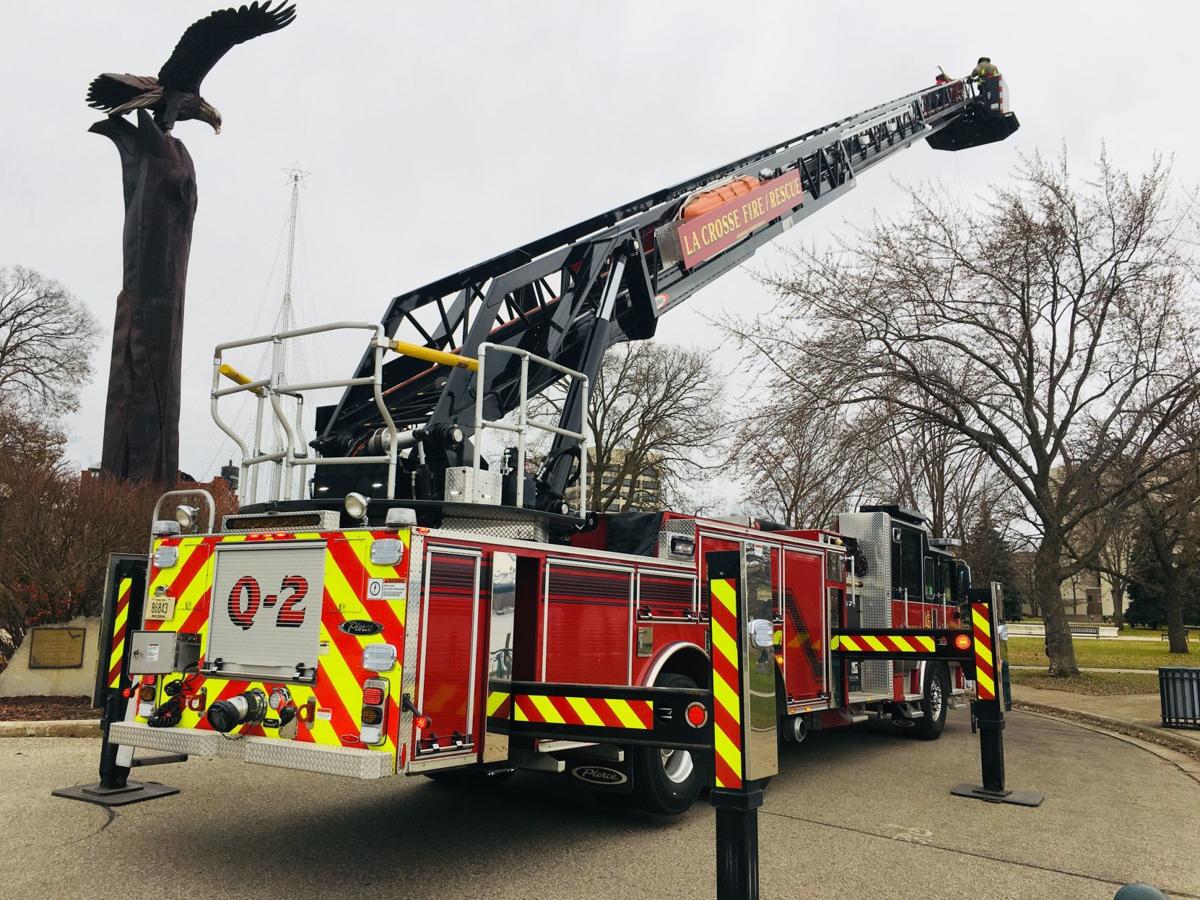 La Crosse firefighters help hang Rotary Lights