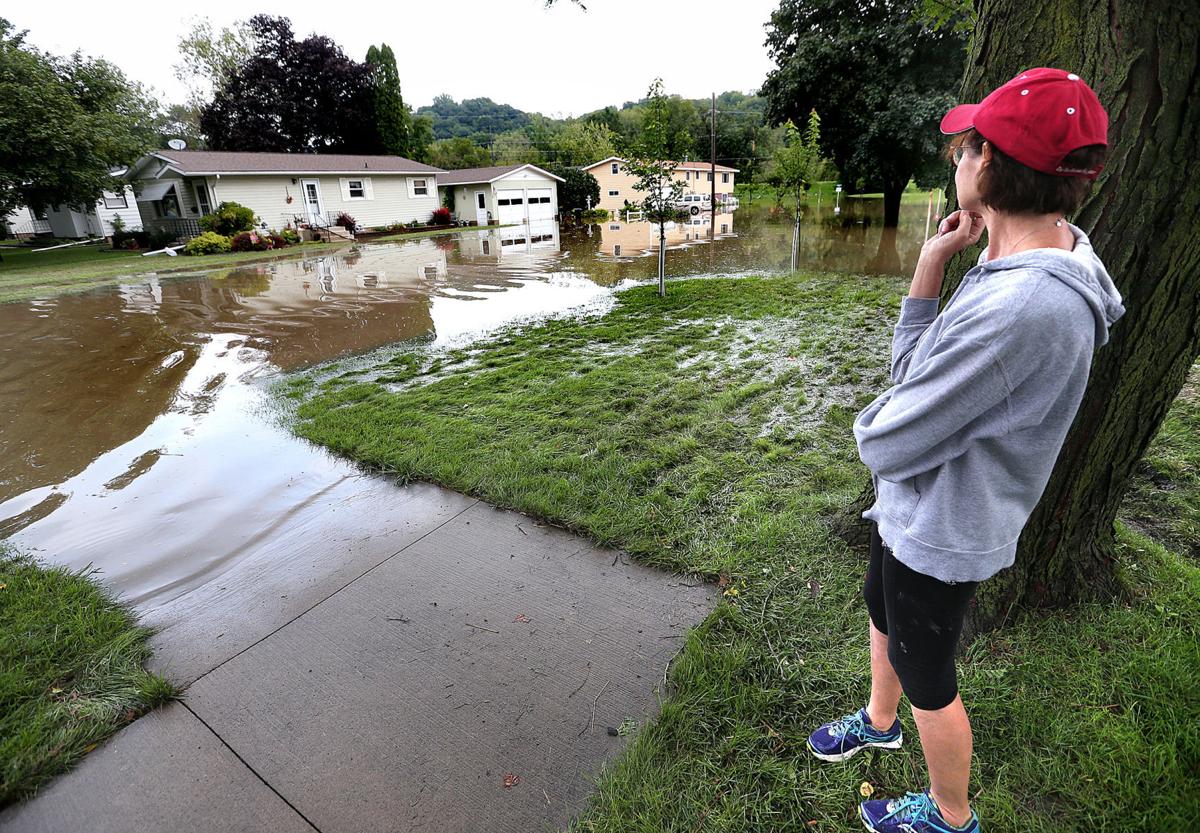 Flash flooding claims one life, leaves northeast to Iowa clean up