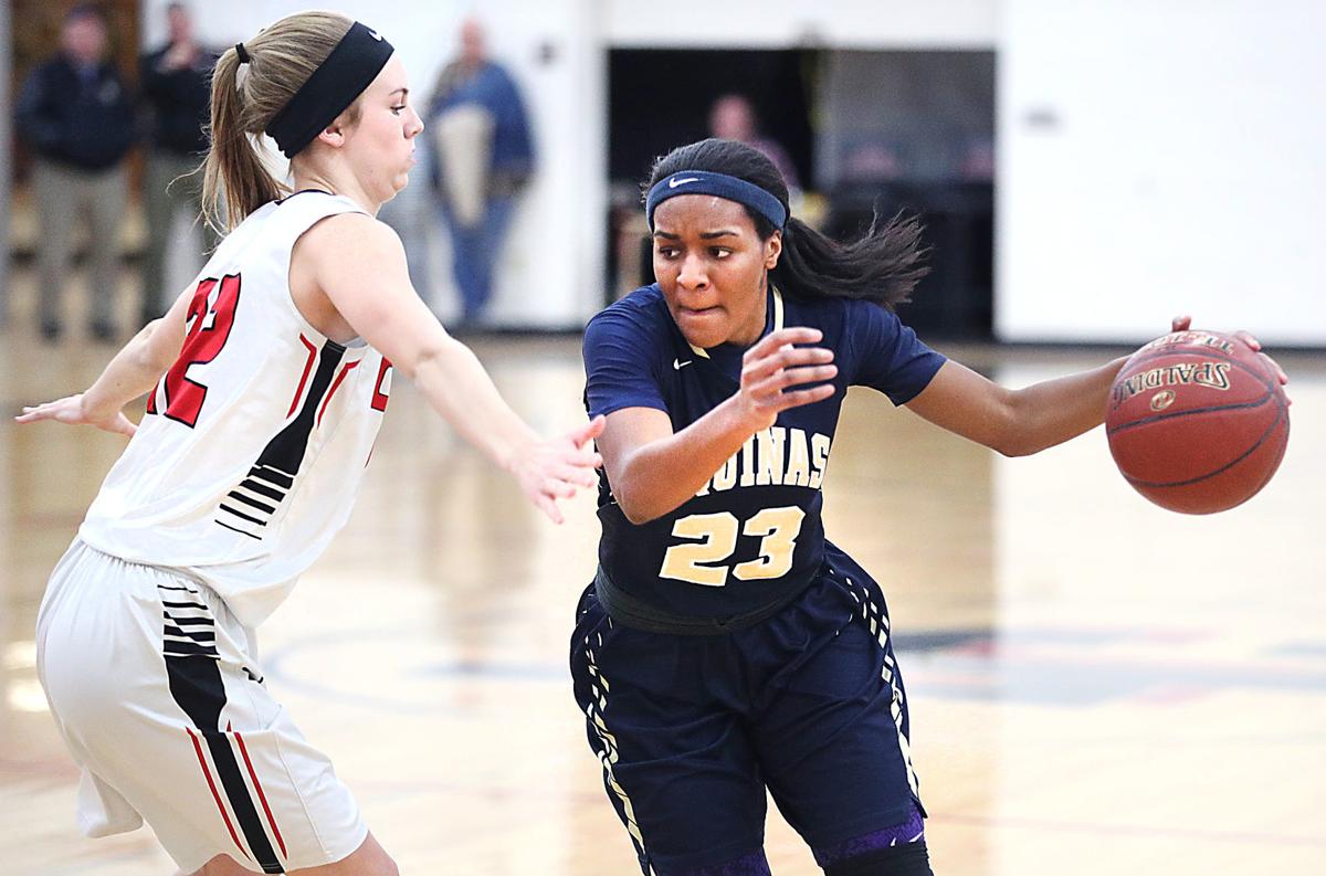 High school basketball La Crosse Aquinas dumps Central to earn share