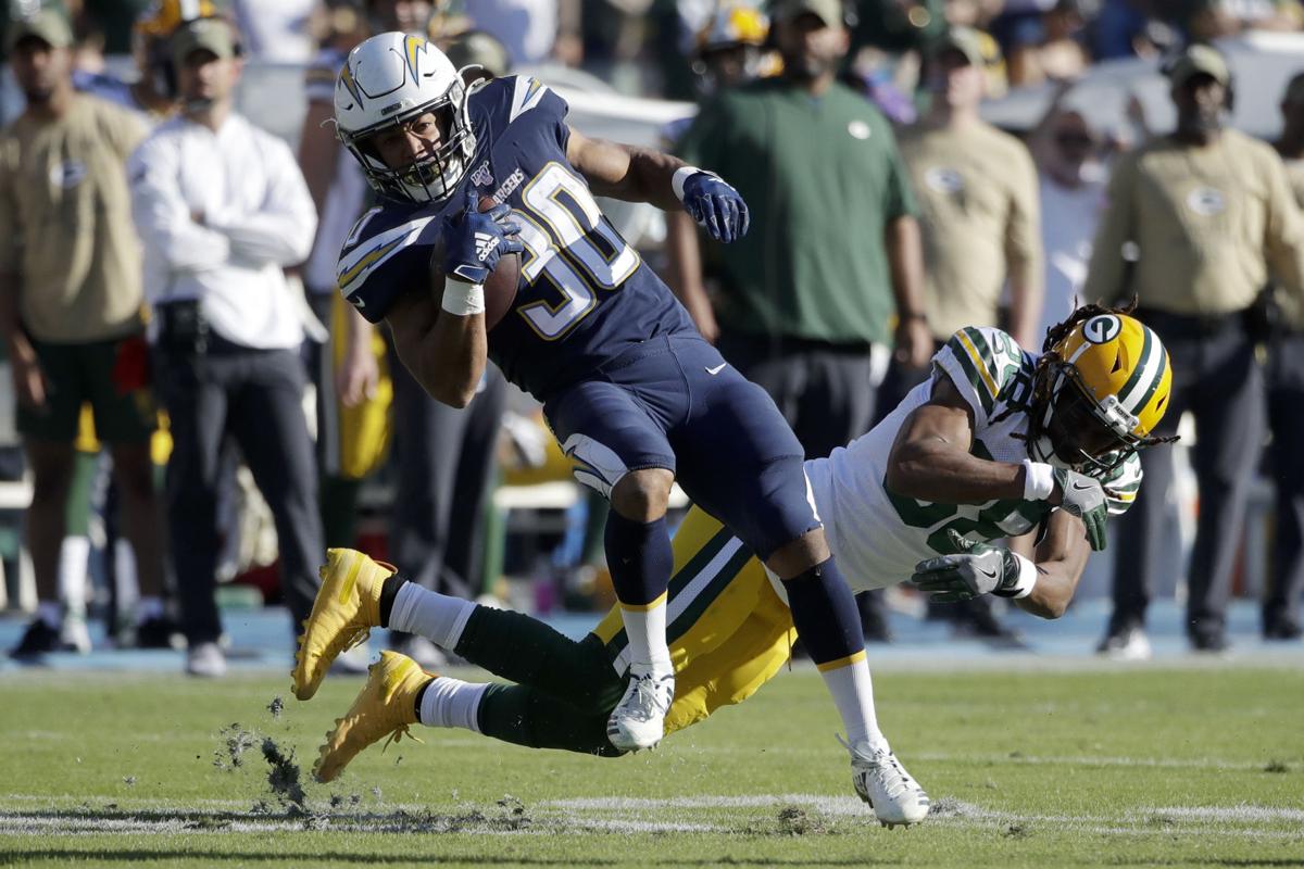 Austin Ekeler, Tramon Williams, AP photo