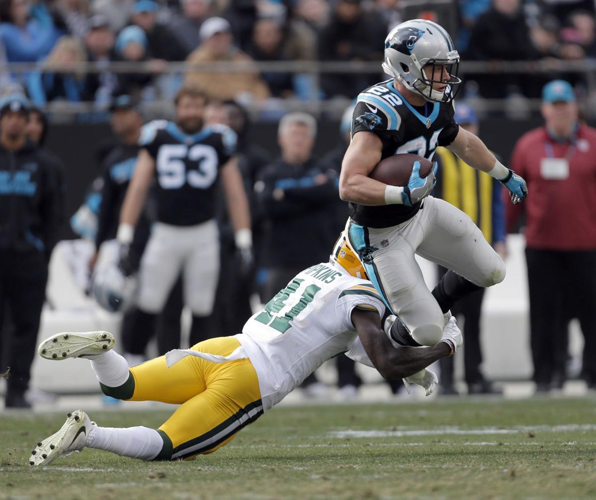 lenzy pipkins tackles christian mccaffrey, ap photo