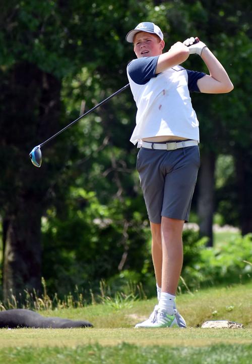 Sam Dobbins hits a tee shot
