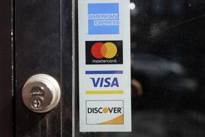 Credit card debt is at record high as Fed raises rates again