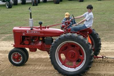 Grandfather and grandson at the tractor pull