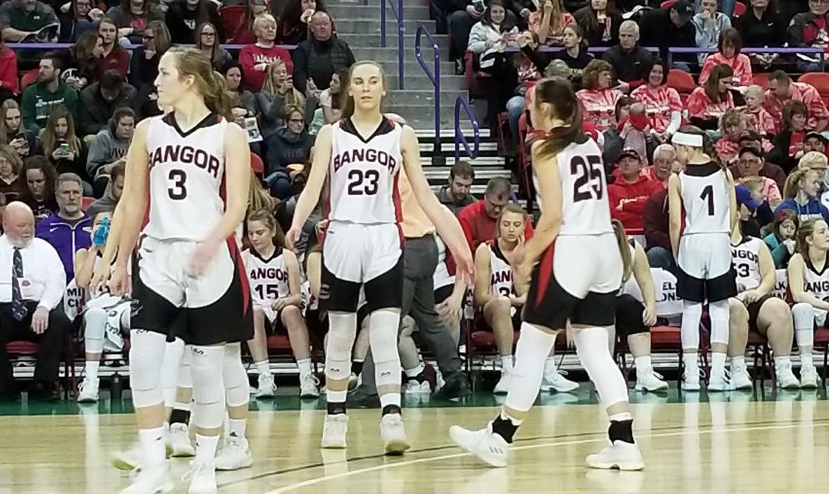 the bangor high school girls basketball team takes the floor after a timeout during a wiaa division 5 state semifinal game against clayton at the resch