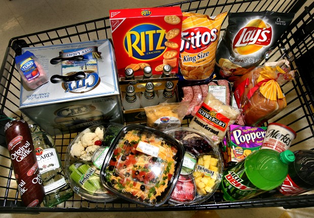 Supplies for a Super Bowl feast will cost less than going to the game