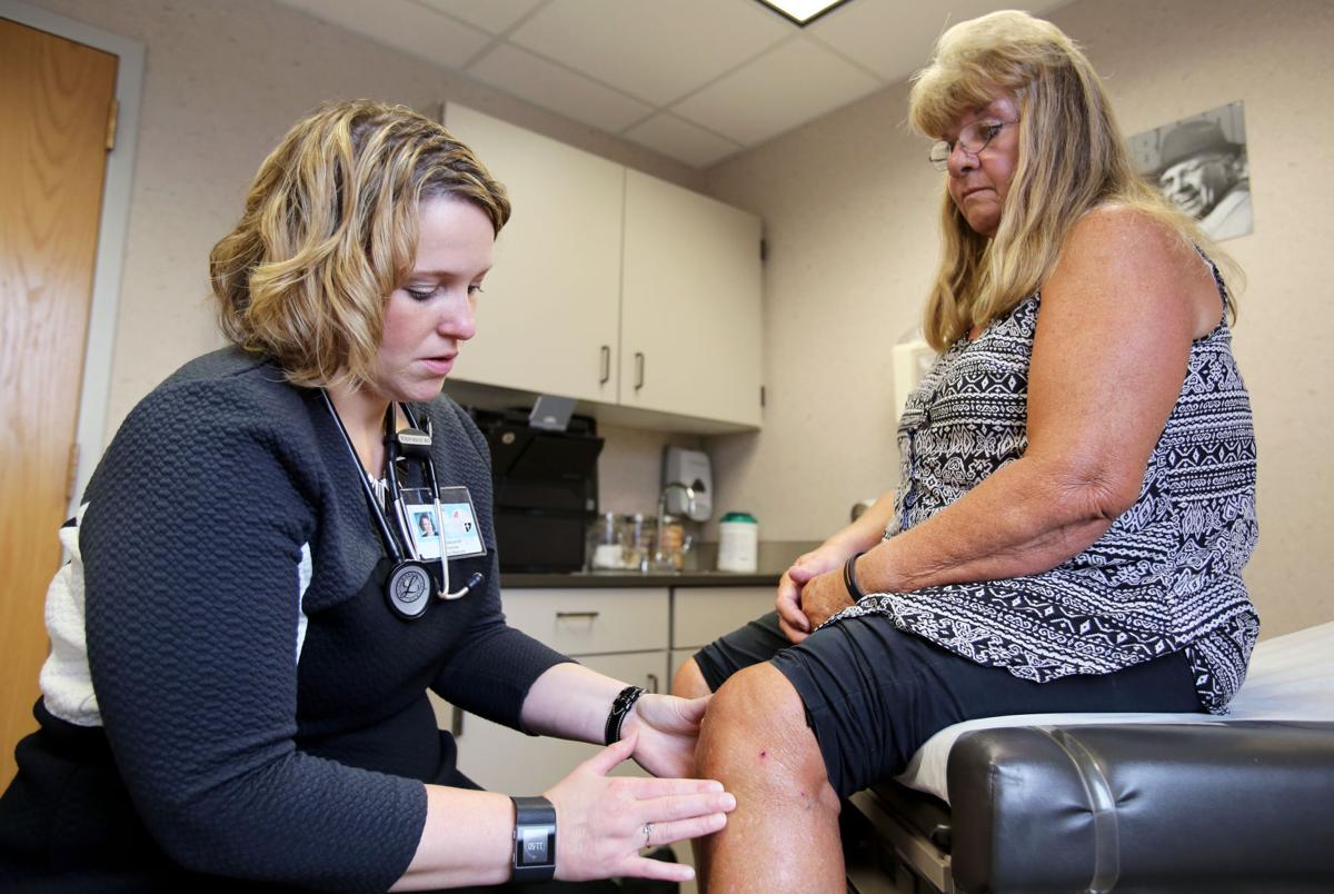 Dr. Sebranek checking Sandy's knee
