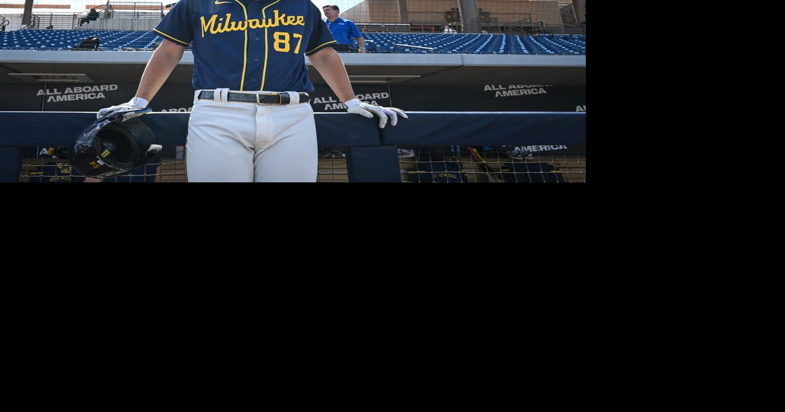 Milwaukee Brewers infield prospect Brady Ebel leans along the dugout rail during spring training workouts Tuesday, February 17, 2026, at American Family Fields of Phoenix in Phoenix, Arizona.