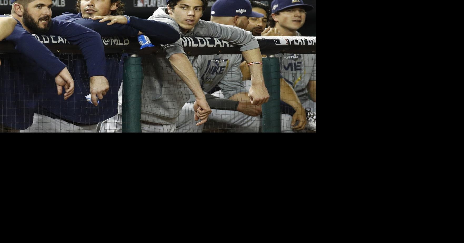 Milwaukee Brewers' Ryan Braun watches from the dugout during the