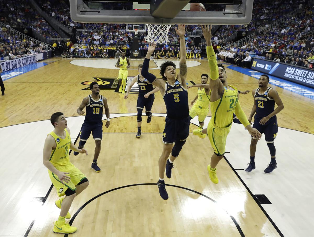 Ducks End Michigan S Run With 69 68 Victory Head To Elite 8
