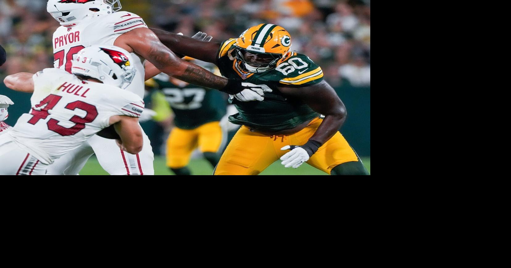 Green Bay Packers defensive tackle Anthony Campbell (60) fights off of a block by Arizona Cardinals offensive tackle Matt Pryor