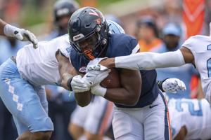 Virginia player wounded in deadly attack returns for a new season, inspires team