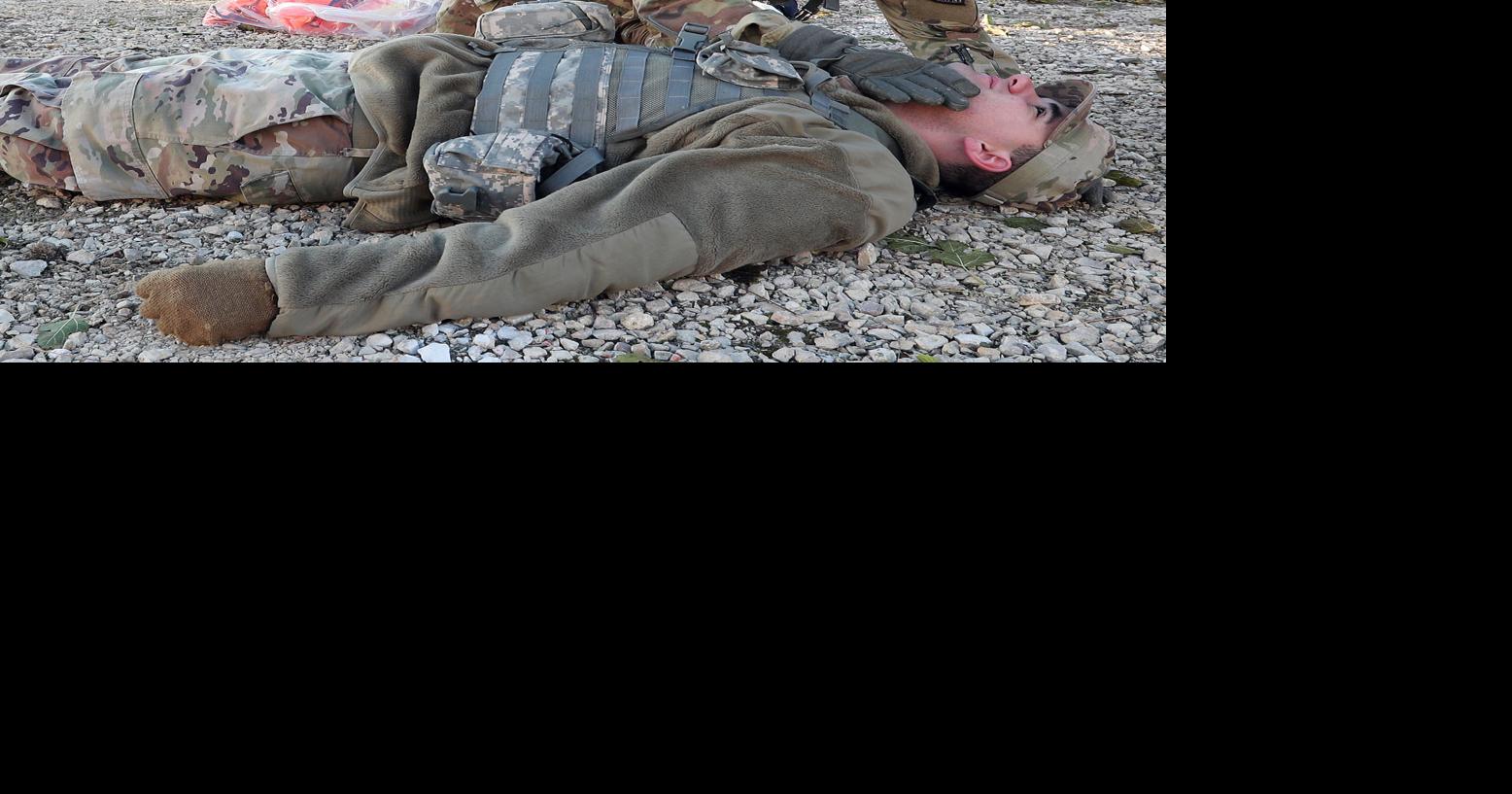 ROTC cadets practice medical training under live-fire conditions
