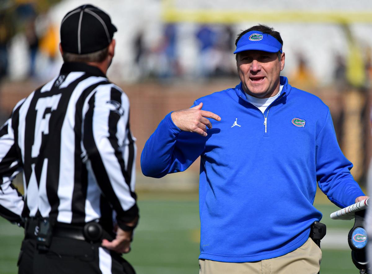 Head coach Dan Mullen of the Florida Gators talks with an official after a penalty call during the second quarter of a game against the Missouri Tigers on Nov. 16, 2019 at Faurot Field/Memorial Stadium in Columbia, Mo.