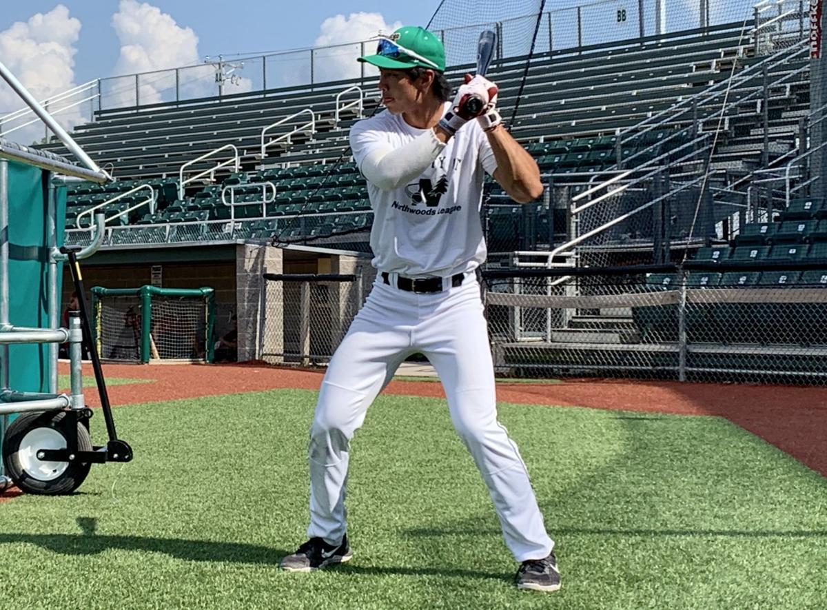 Kobe Kato works on his swing