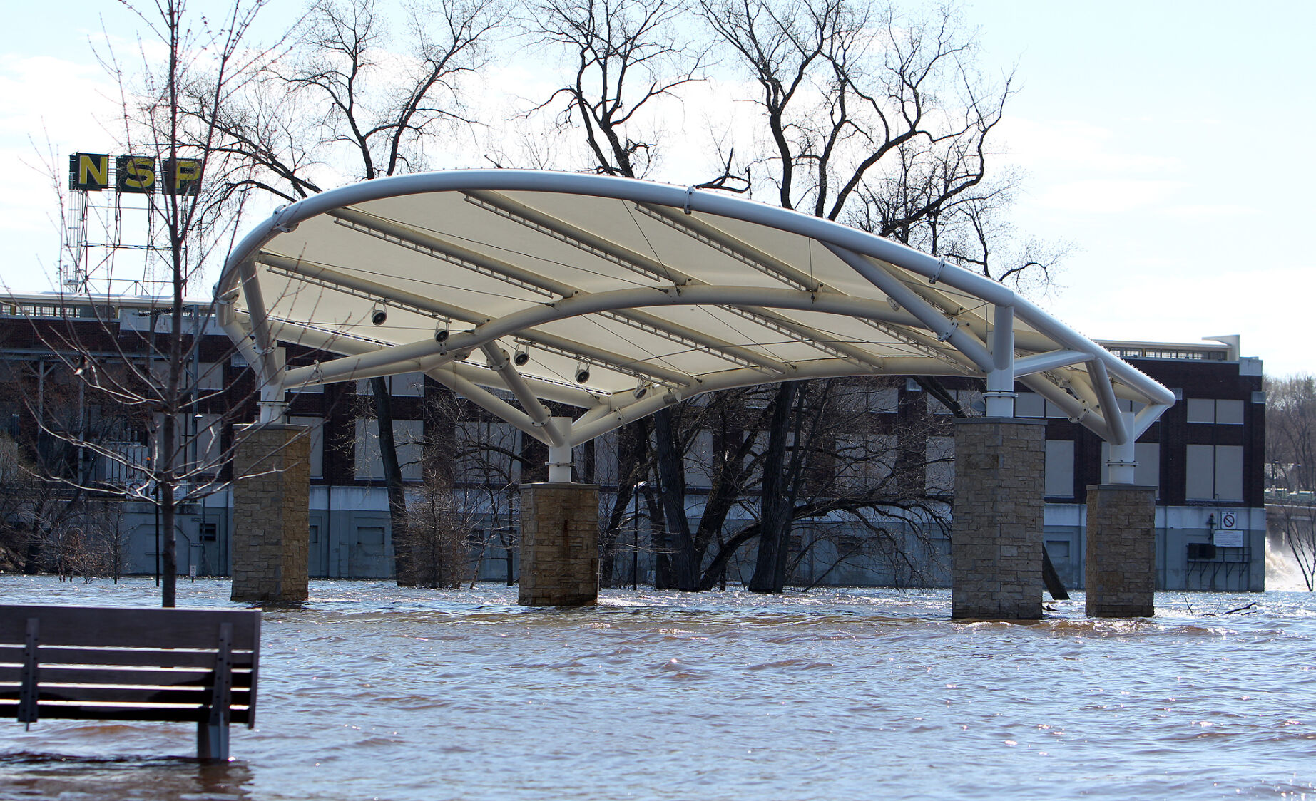 Chippewa River spills out of its banks forces street closures in