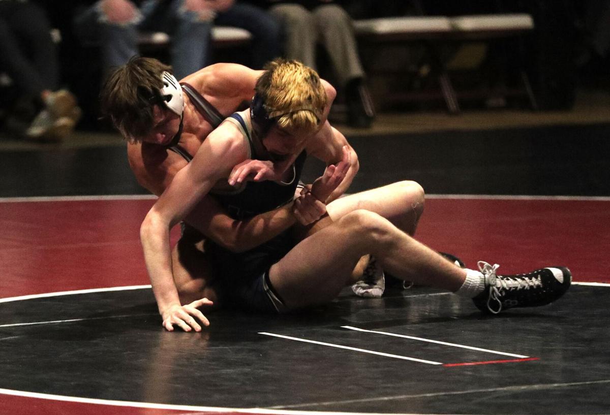 High school wrestling: La Crosse Aquinas goes for two straight over Holmen
