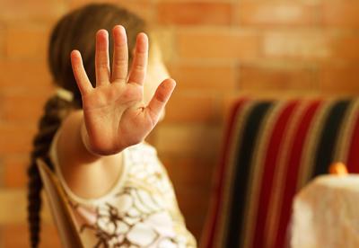 Girl Holding 'Stop' Hand Up