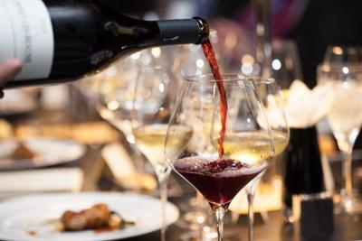 Pouring wine at restaurant table