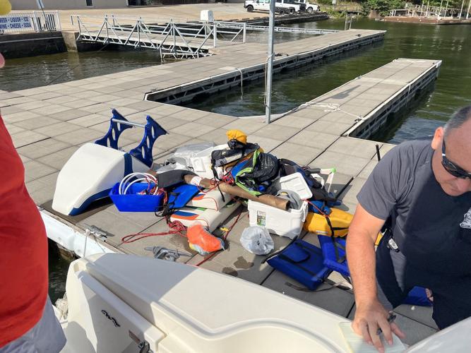 Salvaged parts of the sunken powerboat