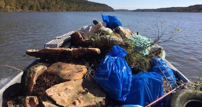 Boat Piled High With Trash Pulled From The Lake Of The Ozarks