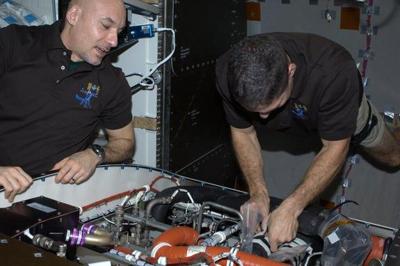 Changing a valve on the Space Station