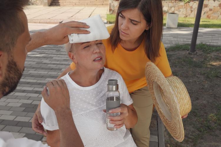 Woman suffering from heat stroke