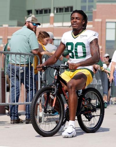 Green Bay Packers wide receiver Isaiah Neyor (80) participates in the Dream Drive bicycle ride before practice on Aug. 7, 2025, in Green Bay, Wis.