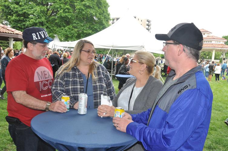 Mike Bransky, Bonnie Bransky, Brandy Wells and Mike Wells share a laugh during Taste of Lake Geneva
