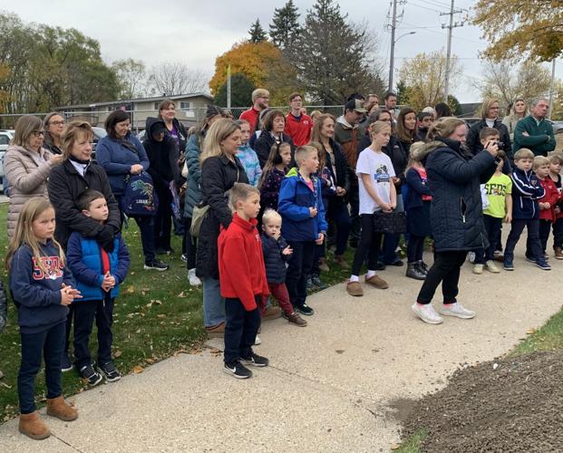 A crowd of people recently attended St. Francis de Sales Parish School's groundbreaking ceremony