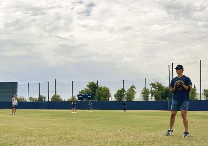 Milwaukee Brewers prospect Frank Cairone plays catch on a backfield at American Family Fields of Phoenix on July 4, 2026. Cairone made his professional debut two days prior, completing his recovery from a serious off-season car accident.