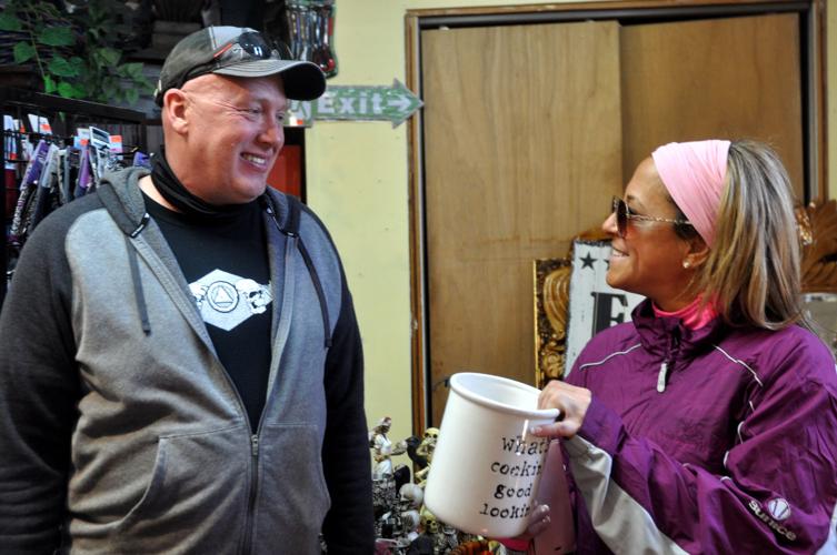 Chuck Settles, left, and Carol Palfroman look over some items at Christine's Gift Shop