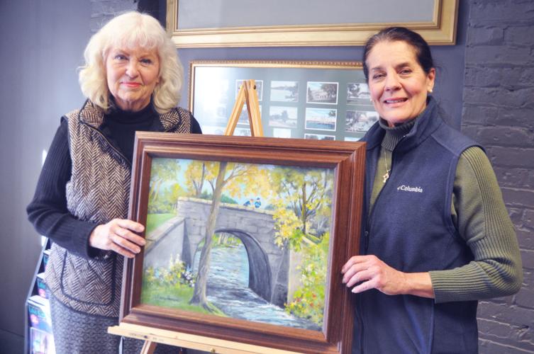Lake Geneva artist Nancy Newcomb donates a painting to Geneva Lake Museum Director