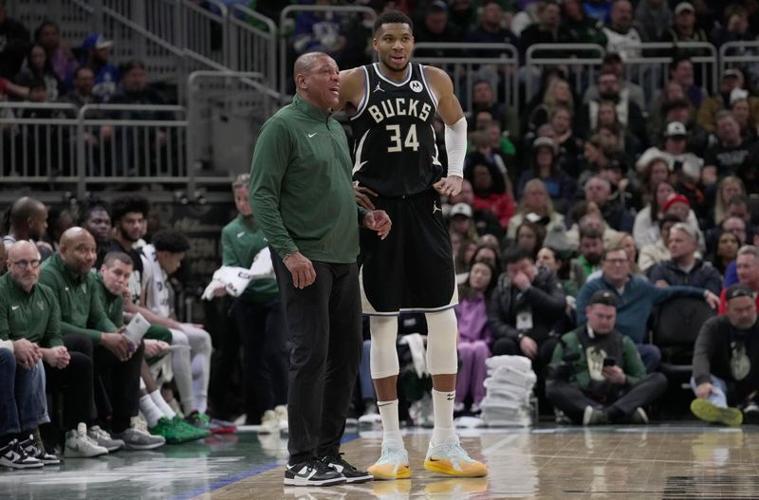 Milwaukee Bucks forward Giannis Antetokounmpo talks with coach Doc Rivers during a January 2025 game.