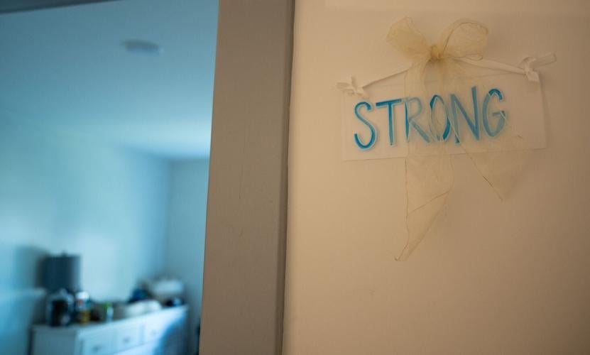 The word “strong” is pinned outside Denise Anderson’s bedroom at Ella's House in Nashville on Friday, April 3, 2026. Anderson is
