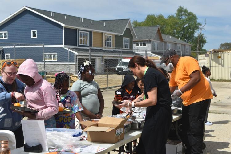 Milwaukee Centers for Independence employees serve a free meal to Julian Thomas students