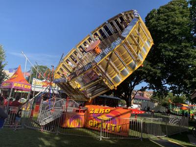 Venetian Festival-goers get dizzy on the Zero Gravity ride