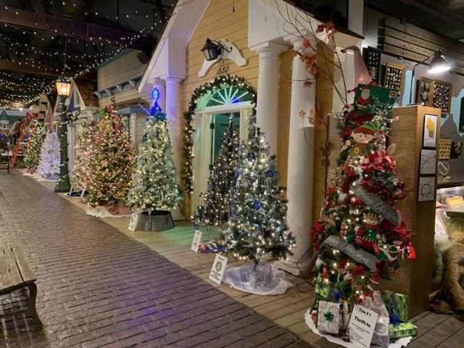 Rows of decorated Christmas trees line the "Main Street" area of the Geneva Lake Museum