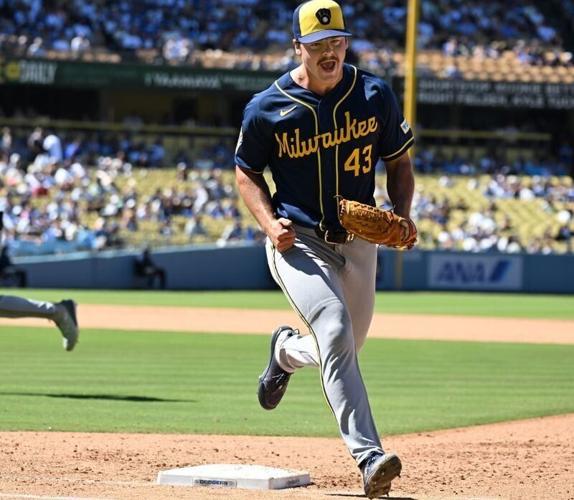 Logan Henderson #43 of the Milwaukee Brewers celebrates after fielding a ball hit by Kyle Tucker #23 of the Los Angeles Dodgers and then forcing him out at first base to end the seventh inning at Dodger Stadium on August 16, 2026 in Los Angeles, Califor...