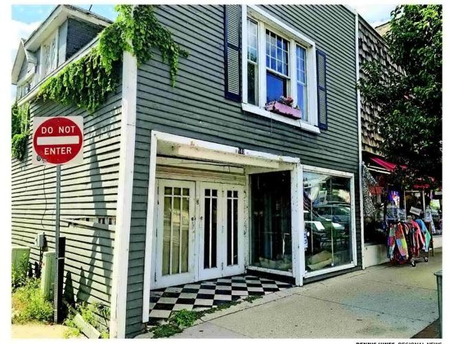 COMMISSION OKS PLAN TO DEMOLISH BUILDING