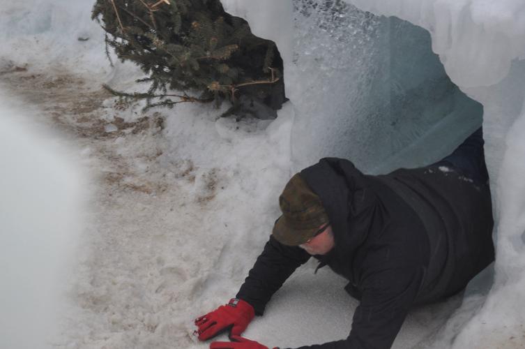 John Church of Genoa City scoots down an ice castle slide on his stomach