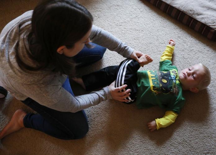 Rikki doing stretches with Theo