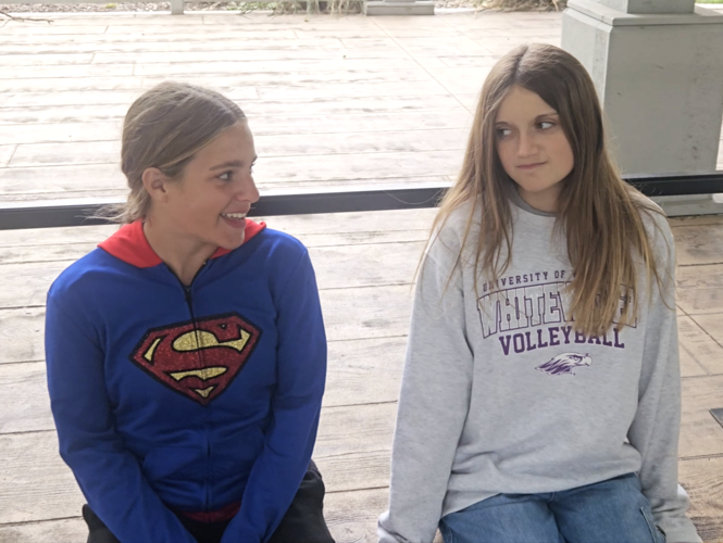 Heather Hawkes and sidekick Robyn in a scene from the Fontana Film Club movie "Super Falcon"