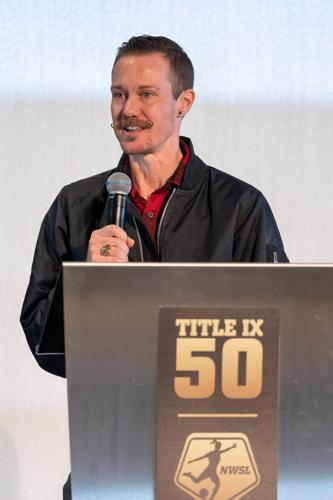 Transgender athlete and thought leader on LGBTQ+ inclusion in sports Chris Mosier participates in a panel discussion at the NWSL Score More for Title IX event at the International Spy Museum on Oct. 28, 2022, in Washington, D.C.