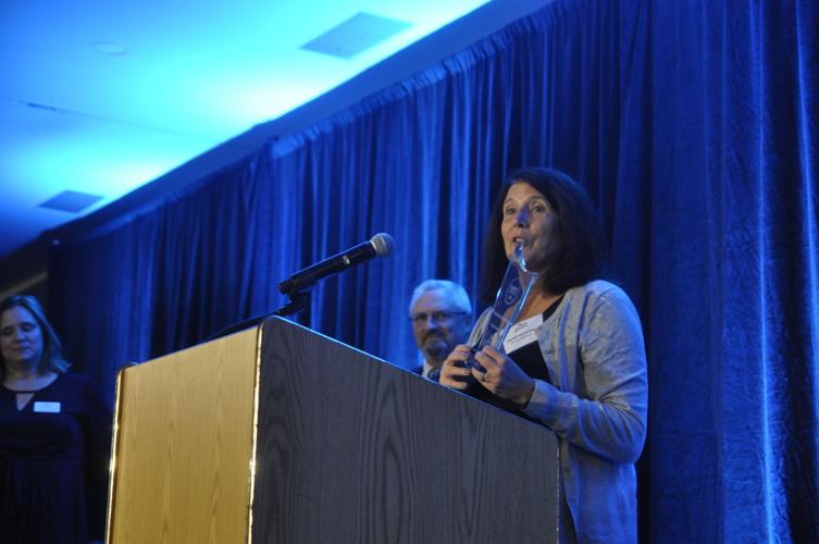 Heidi McGraw, co-owner of Geneva Tap House, accepts the Rising Star Award on behalf of the tap house