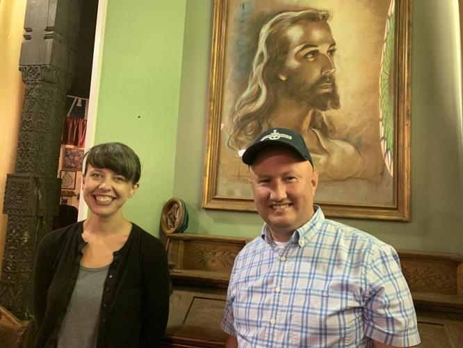 Jason Fischer and Stefanie Wessel stand in front of a "Head of Christ" rendering that they have loaned to the Geneva Lake Museum