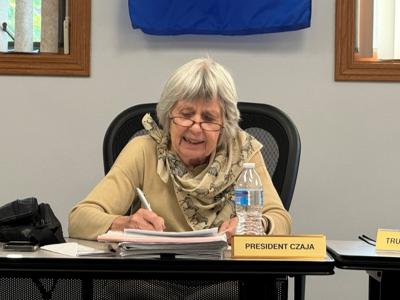 Walworth Village President Louise Czaja signs resolution congratulating Fontana on centennial anniversary of incorporation