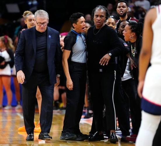 South Carolina head coach Dawn Staley (right) yells at Connecticut head coach Geno Auriemma at Mortgage Matchup Center during the Women's Final Four in Phoenix on April 3, 2026.